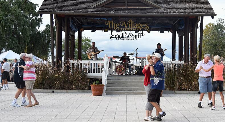 Residents dance in the square of The Villages retirement community in 2016.
