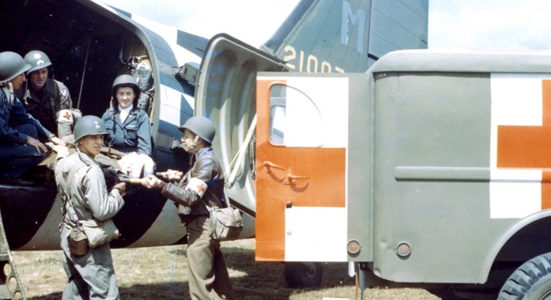 US Army nurses and medics remove a bandaged soldier from a C-47 transport plane to an ambulance during a rehearsal for D-Day.PhotoQuest/Getty Images