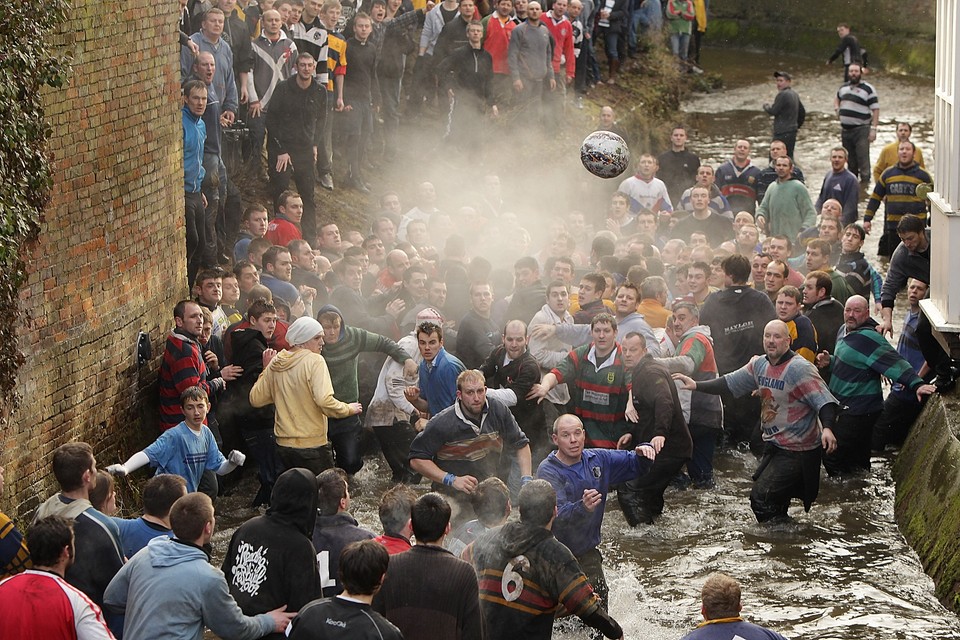 Enthusiasts Participate In The Royal Shrovetide Football Match