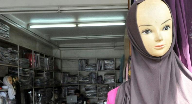 Islamic headware is sold in a Chinese owned store in the quarter of Derb Omar in Casablanca on March 10, 2011