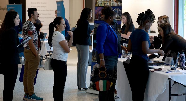 Job seekers are at a job fair in Florida in 2023.Joe Raedle/Getty Images