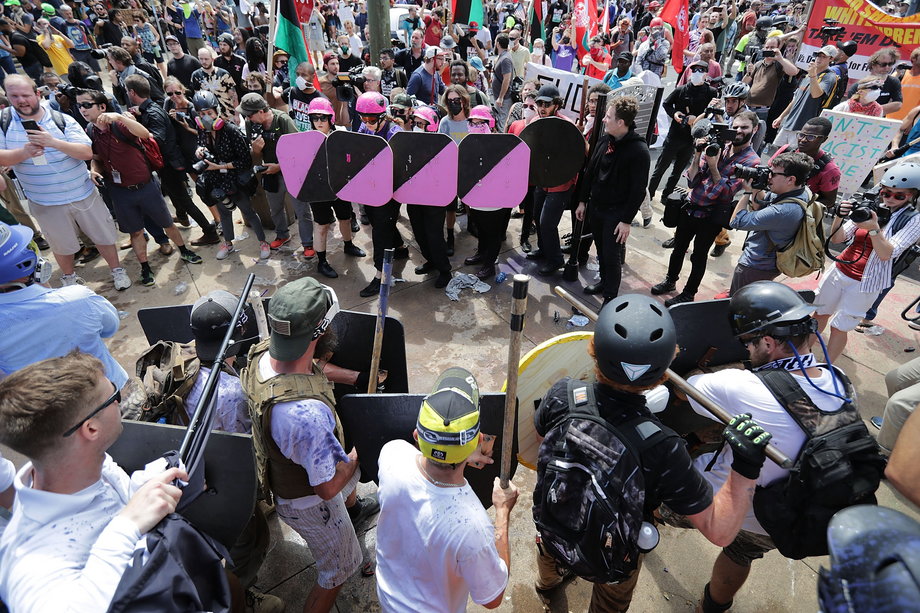 Battle lines form between white nationalists, neo-Nazis and members of the 'alt-right' and anti-fascist counter-protesters at the entrance to Emancipation Park during the 'Unite the Right' rally August 12, 2017 in Charlottesville, Virginia.