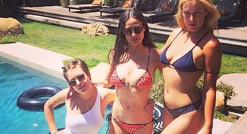 Demi Moore looking stunning in her bikini flanked by daughters