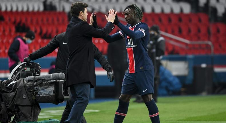 Pochettino celebrates his first win, 3-0 against Brest, with striker Moise Kean