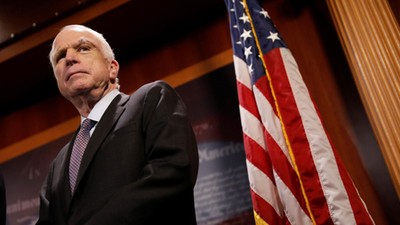 Senator John McCain (R-AZ) looks on during a press conference about his resistance to the so-called 