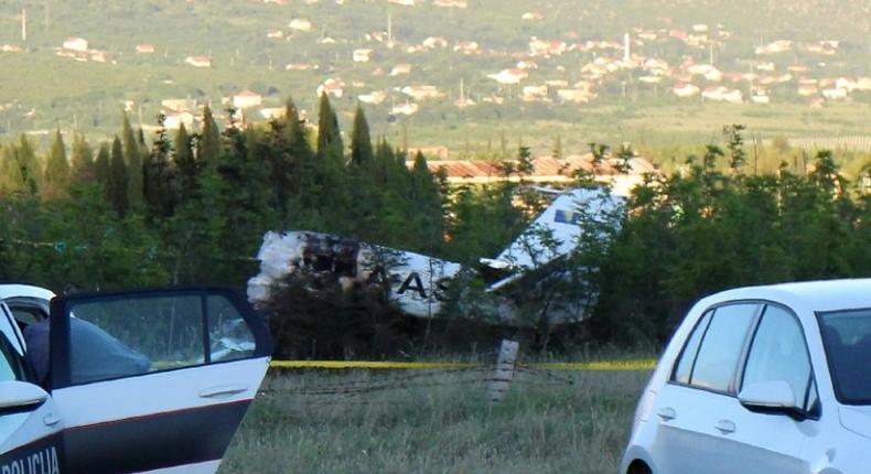 Bosnian police and Civil Aviation Investigators are seen near the site where a light planed crashed near Mostar, Bosnia and Herzegovina, on May 13, 2017