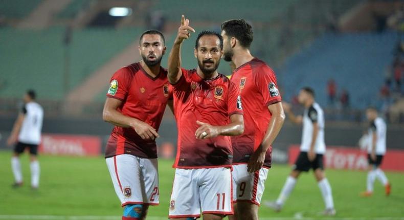 Al-Ahly's Egyptian forward Walid Soliman (C) celebrates with teammates after scoring during the CAF Champions League semifinal first leg football match Al-Ahly vs ES Setif at al-Salam stadium in Cairo on October 2, 2018.