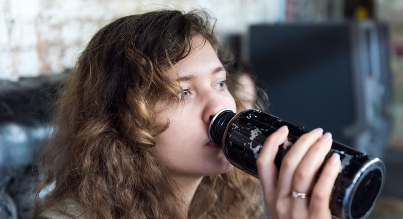 woman drinking water bottle