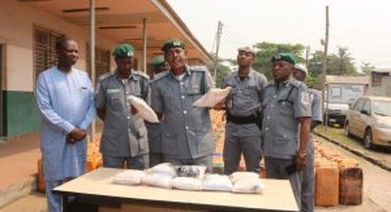 Comptroller Bello Jibo, the Area Controller of Customs, Seme Command, displaying 11.931kg of Cocaine in Seme. [NAN]