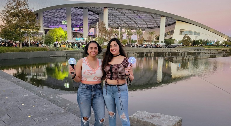 The author (right) with a friend at the BTS concert in Los Angeles on November 28.