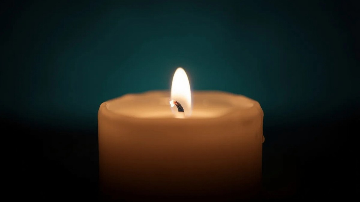 A,Single,Lit,Candle,Glowing,Warmly,In,Soft,Darkness.,Simple,