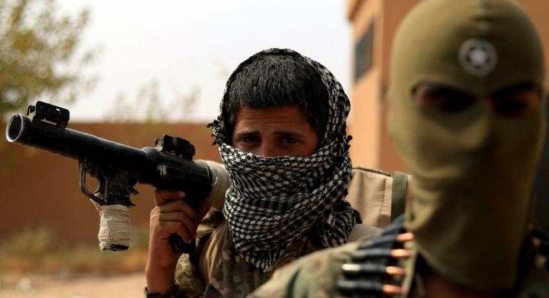 Fighters of the Kurdish-dominated Syrian Democratic Forces gather on September 13, 2018 for the US-backed offensive which has culminated in their capture of the Islamic State group's last enclave