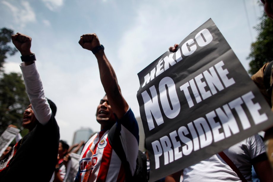 Protestors with a sign reading, "Mexico has no president."