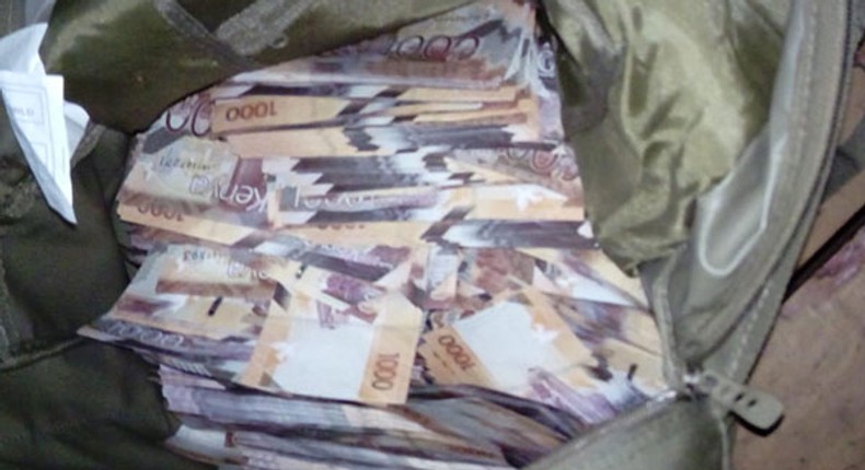 File image of money in a bag confiscated by police as evidence