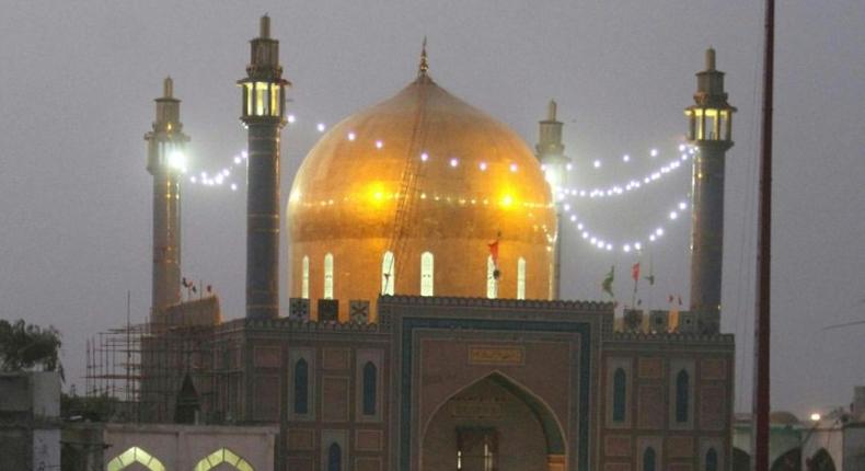 Pakistani devotees gather at the 13th-century Lal Shahbaz Qalandar shrine in Sehwan in 2014