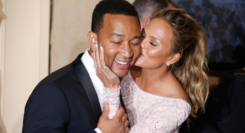 Chrissy Teigen and John Legend are a poster couple for PDA [Credit Getty]