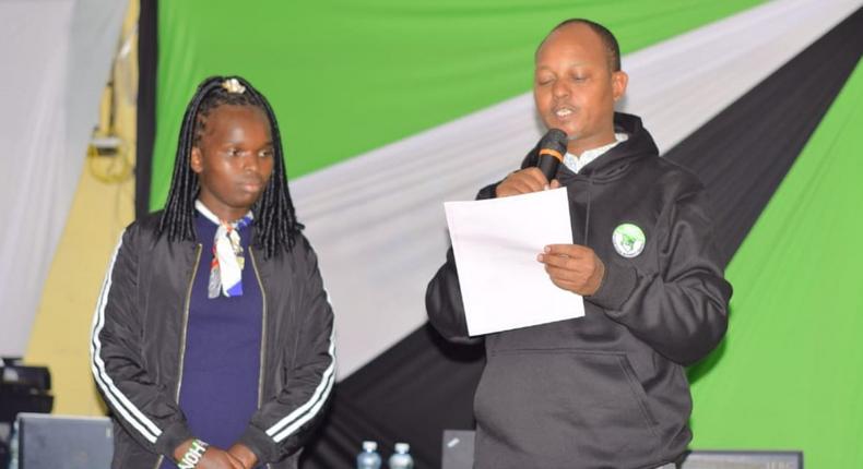 Linet 'Toto' Chepkorir receiving her certficate from IEBC