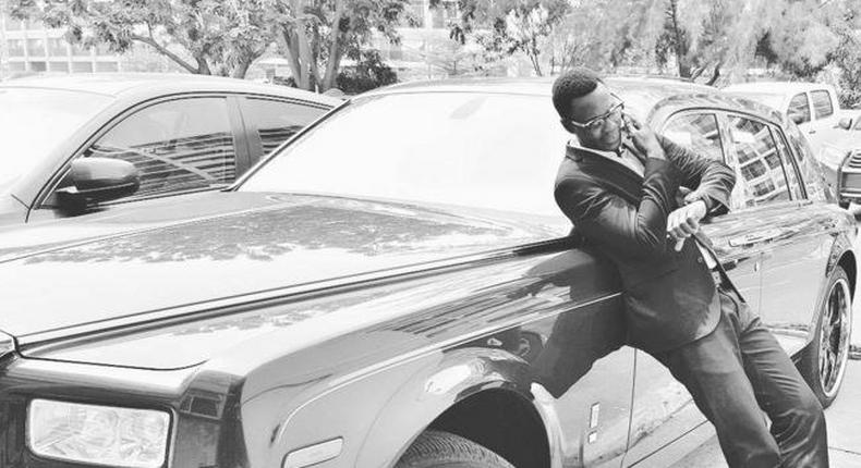 Sound Sultan leaning on a Rolls Royce Phantom 