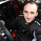 Robert Kubica za kierownicą samochodu rajdowego drzwi otwarte