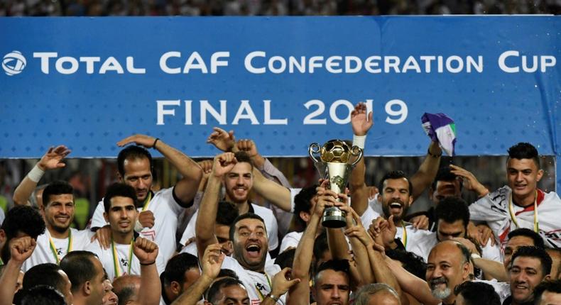 Egypt's Zamalek players celebrate with the trophy after they won the CAF Confederation Cup final on penalties against Morocco's RSB Berkane