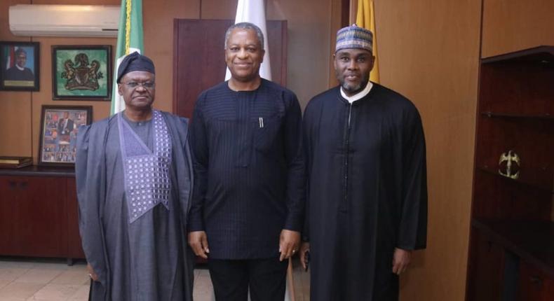 Foreign Affairs Minister Geoffrey Onyeama flanked by the Minister of State Amb. Zubairu Dada (left) and the Permanent Secretary in the ministry, Amb. Mustapha Suleiman ( right) pose for a shot when the minister assumed office on Wednesday in Abuja.  [NAN]