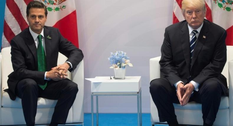 Mexican President Enrique Pena Nieto (L) says he has not recently spoken to Donald Trump on the phone, countering US leader's claim