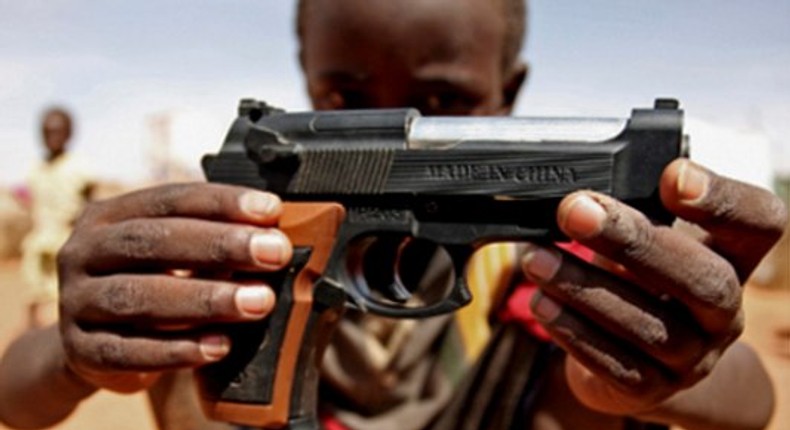 A child with Pistol gun