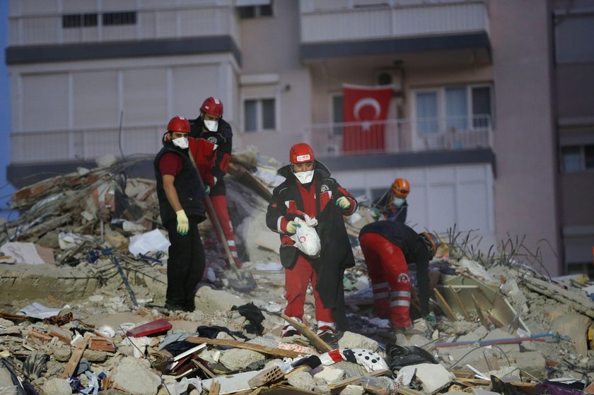 Rescue operations take place on a site after an earthquake struck the Aegean Sea, in the coastal pro