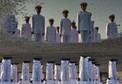 Indian Navy sailors are reflected in a puddle as they take part in a ceremonial parade during the Republic Day celebrations in Kochi