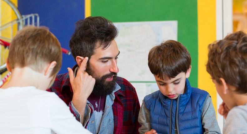 A teacher instructs a group of children at Brightworks, a primary school in San Francisco's Mission District.