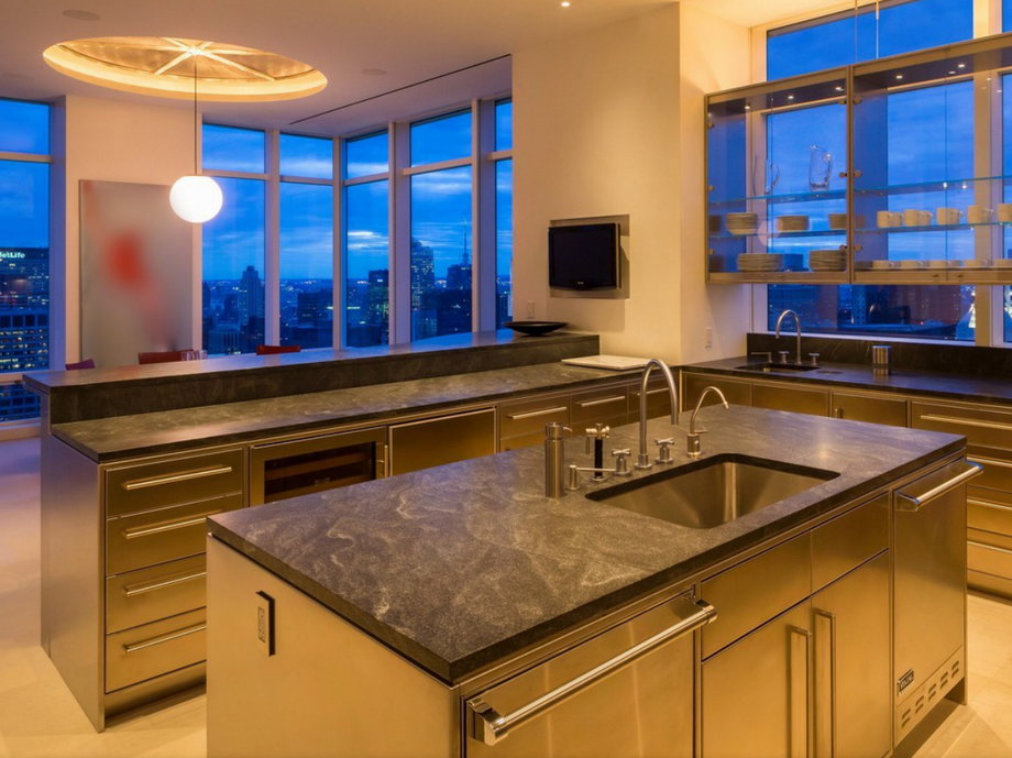 The kitchen is sleek and spotless.
