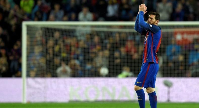 Barcelona's forward Lionel Messi celebrates after scoring a goal during the Spanish league football match against Osasuna April 26, 2017