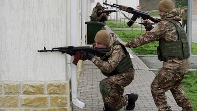 Chechen special forces troops take up firing positions as they attend a training session at a Russian University of Special Forces training centre in the town of Gudermes in Chechnya on December 13, 2022.STRINGER/AFP via Getty Images