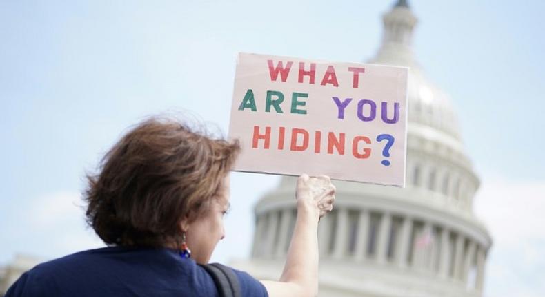 Protestors take part in the Tax March to call on US President Donald Trump to release his tax records on April 15, 2017 in Washington, DC