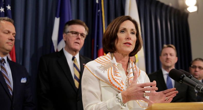 Texas Sen. Lois Kolkhorst, front, backed by Texas Lt. Gov. Dan Patrick, center, and other legislators talks to the media during a news conference to discuss Senate Bill 6 at the Texas Capitol, Monday, March 6, 2017, in Austin, Texas.