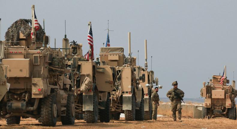 American military convoy stops near the town of Tel Tamr, north Syria, Sunday, Oct. 20, 2019.