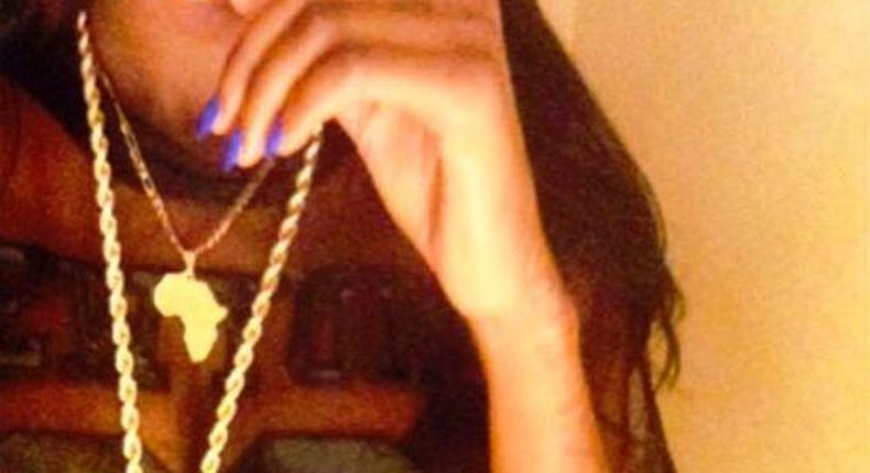 Sira Kante poses with Davido's customized HKN chain