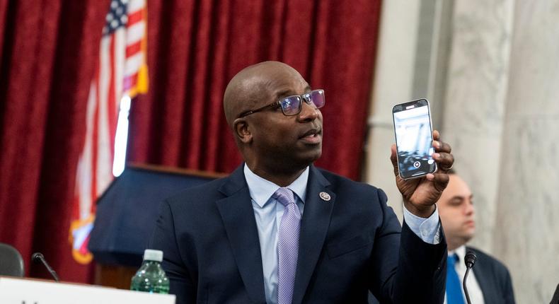 Democratic Rep. Jamaal Bowman of New York holds up a phone at the Capitol in May 2022.Tom Williams/CQ-Roll Call via Getty Images