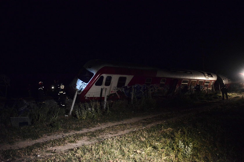 A derailed train carriage is seen toppled in the town of Adendro in northern Greece