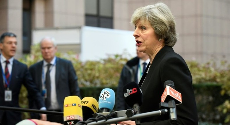 British Prime Minister Theresa May addresses the media as she arrives for an EU leaders' summit in Brussels on December 15, 2016