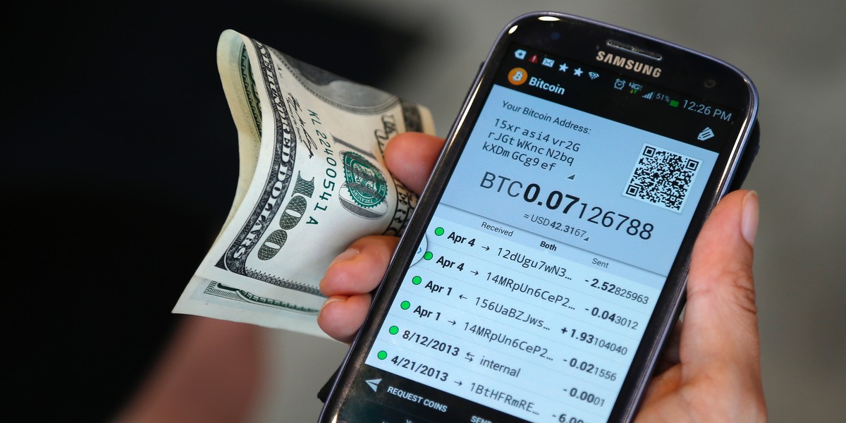 Dana Byerlee, 33, of Santa Monica, prepares to use one of Southern California's first two bitcoin-to-cash ATMs, in Locali Conscious Convenience store in Venice, Los Angeles, California, June 21, 2014.