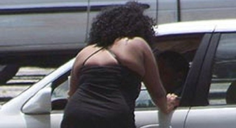 A prostitute negotiating with her customer