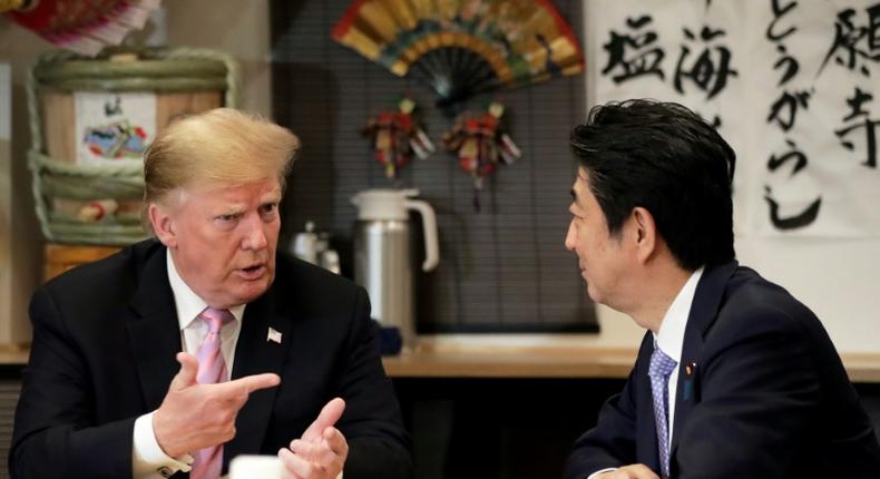 President Trump (L) and Japan's Shinzo Abe dined Sunday at a traditional Japanese grill restaurant, with wagyu beef and vanilla ice cream among the menu items