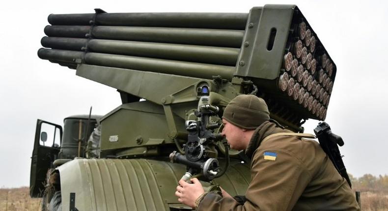 A Ukrainian serviceman aims a 122 mm MLRS BM-21 Grad during military exercises near Kiev on October 28, 2016