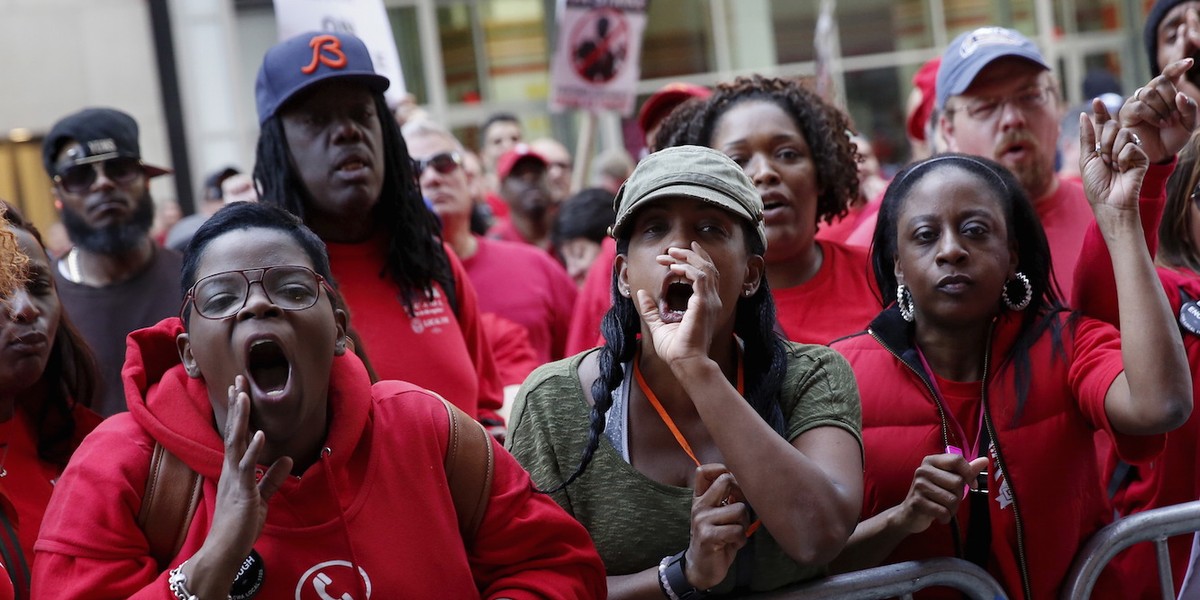 Demonstrators outside a Verizon wireless store during a strike in New York.