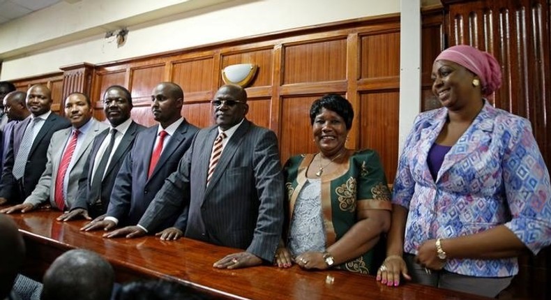 Kenyan politicians Aisha Jumwa, Florence Mutua, Johnstone Muthama, Junet Mohammed, Timothy Bosire, Ferdinand Waititu, Moses Kuria and Kimani Ngunjiri stand in the dock at the Milimani Law Courts over alleged hate speech, flagging growing tension in Kenya's capital Nairobi, June 14, 2016. 