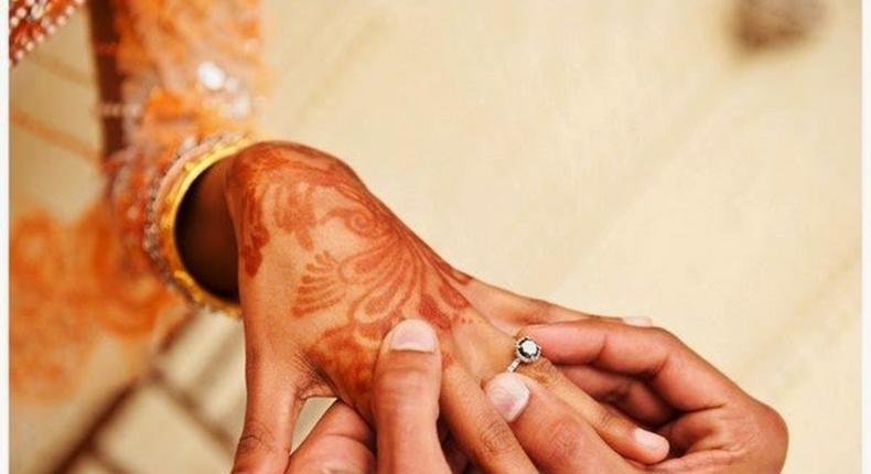 Couple exchanging rings