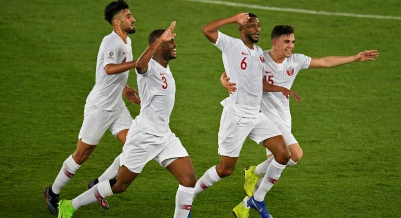 Qatar players celebrate scoring in their Asian Cup final win over Japan