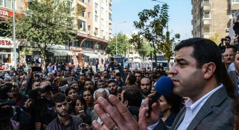 Turkish police have detained the two co-leaders of the country's main pro-Kurdish party, including Selahattin Demirtas (R), held at his home in Diyarbakir