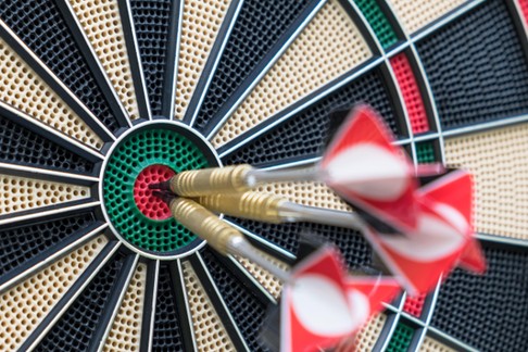 Close-Up Of Arrows In Dartboard